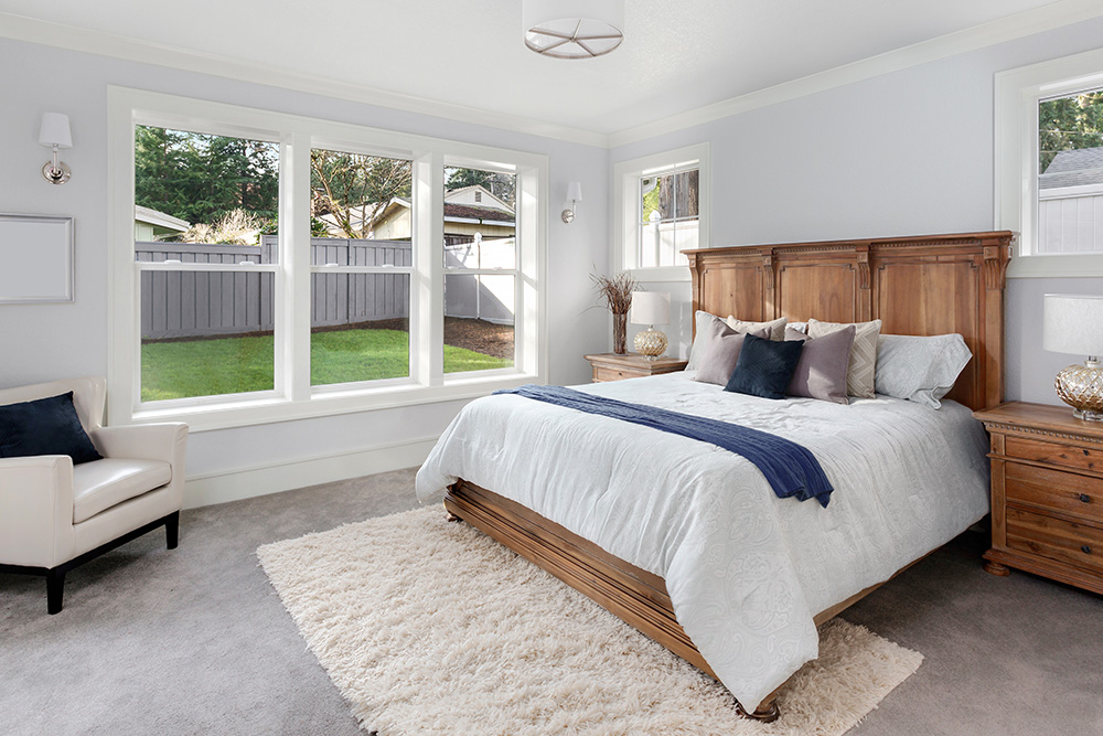 renovated bedroom with a large window