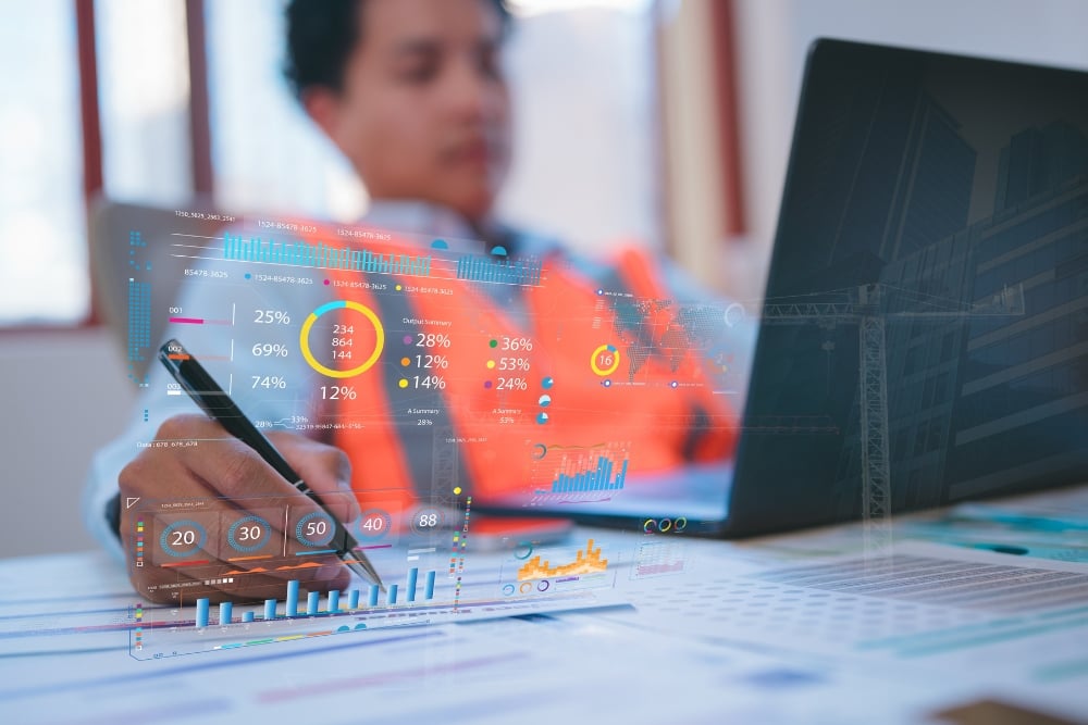 Kennards Hire team member with a report