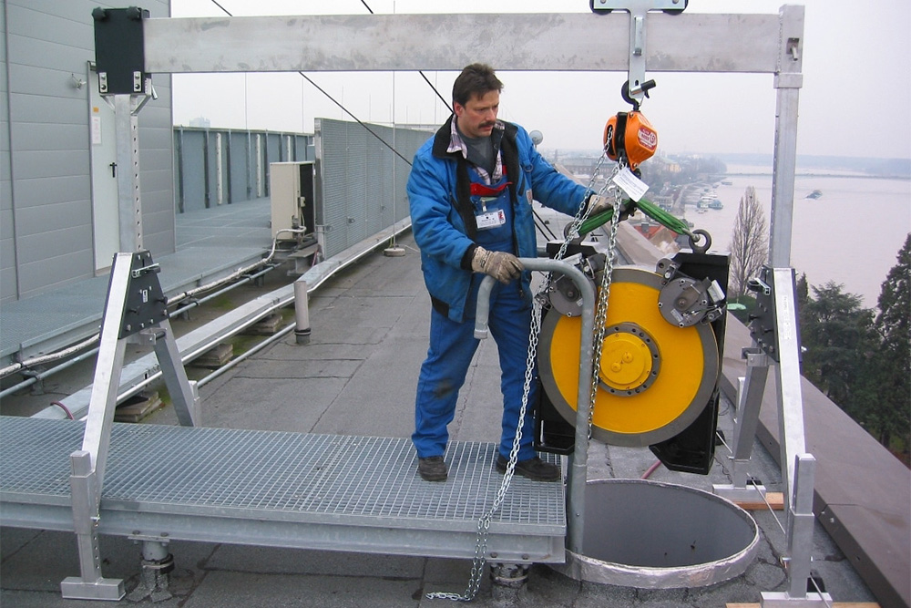 A set of three gantries setup inside a warehouse