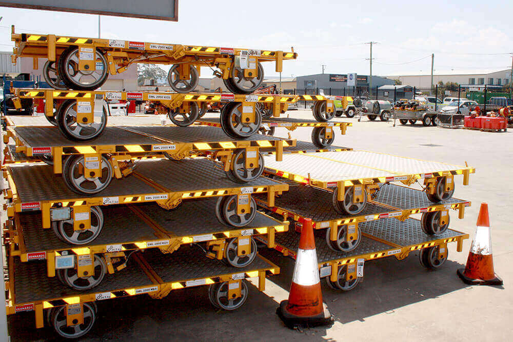 Rail trollies tacked on one another in an equipment yard