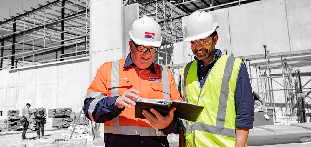 Kennards hire team member working with a project manager on a job site